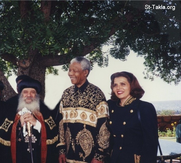 St-Takla.org Image: Pope Shenouda III with President Nelson Rolihlahla Mandela of South Africa and his wife     :             