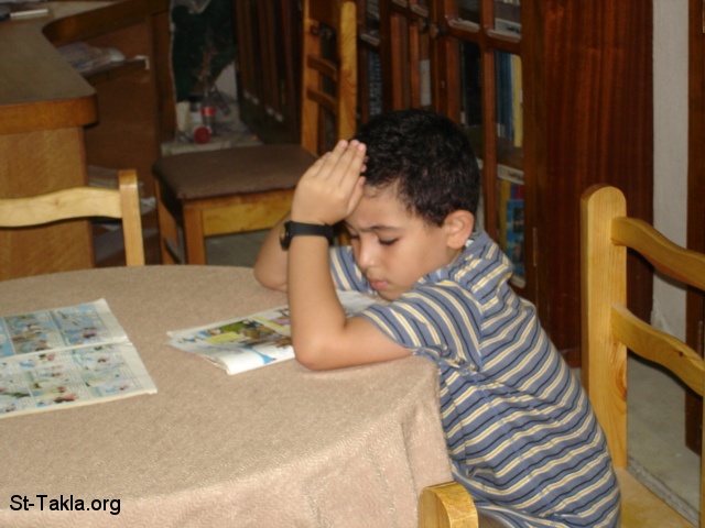 St-Takla.org Image: A boy reading Mickey Mouse magazine, at St. Arsanios library, at St. Takla Church, Alex., Egypt     :        ӡ   ǡ ɡ 