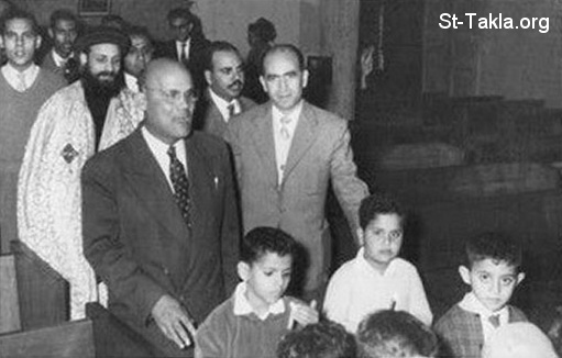 St-Takla.org Image: The Late Mr. Youssef Habib in the early sixties of the 20th century at the Church as cantor, with the late Father Pishoy Kamil of St. George Sporting Church, Alexandria, Egypt     :                       ̡ ɡ 