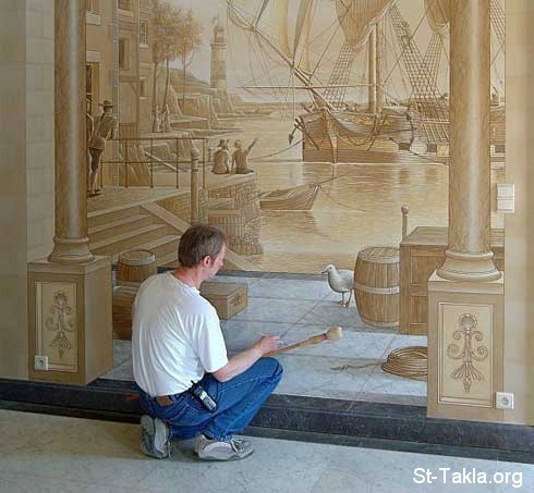 St-Takla.org         Image: An artist making a 3D wall painting صورة: فنان يقوم برسم لوحة ثلاثية الأبعاد على الحائط